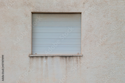 Damaged Building Facade with Window