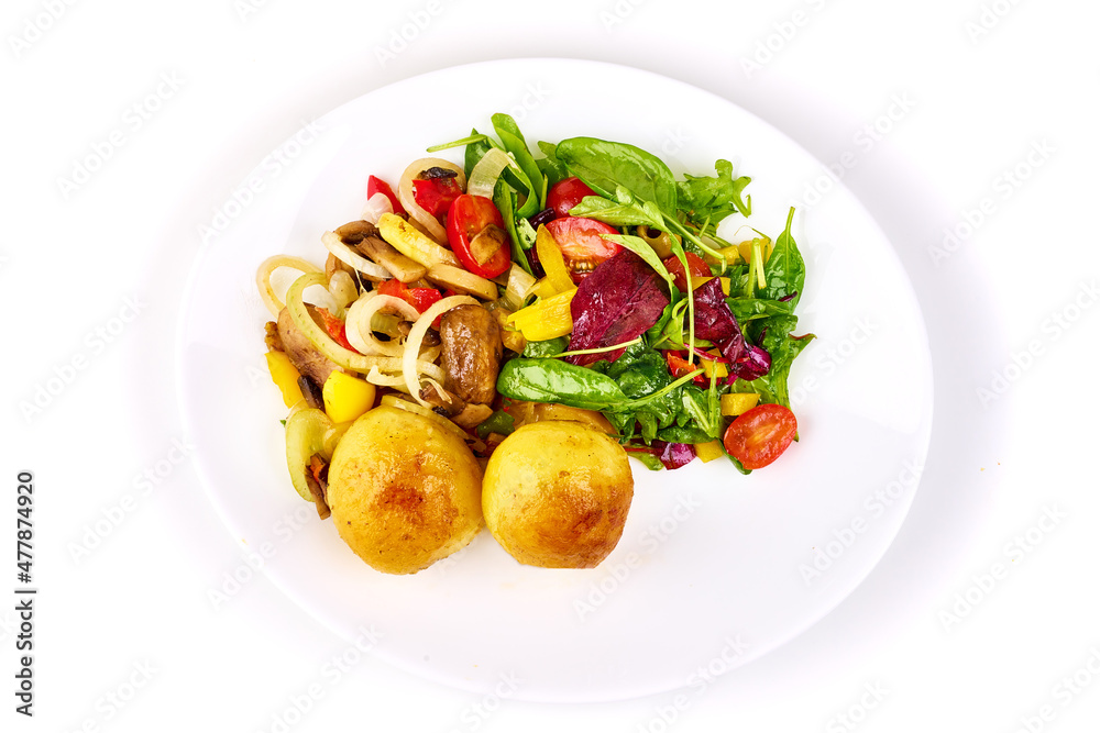 Baked potatoes with vegetables and mix salad, isolated on white background.