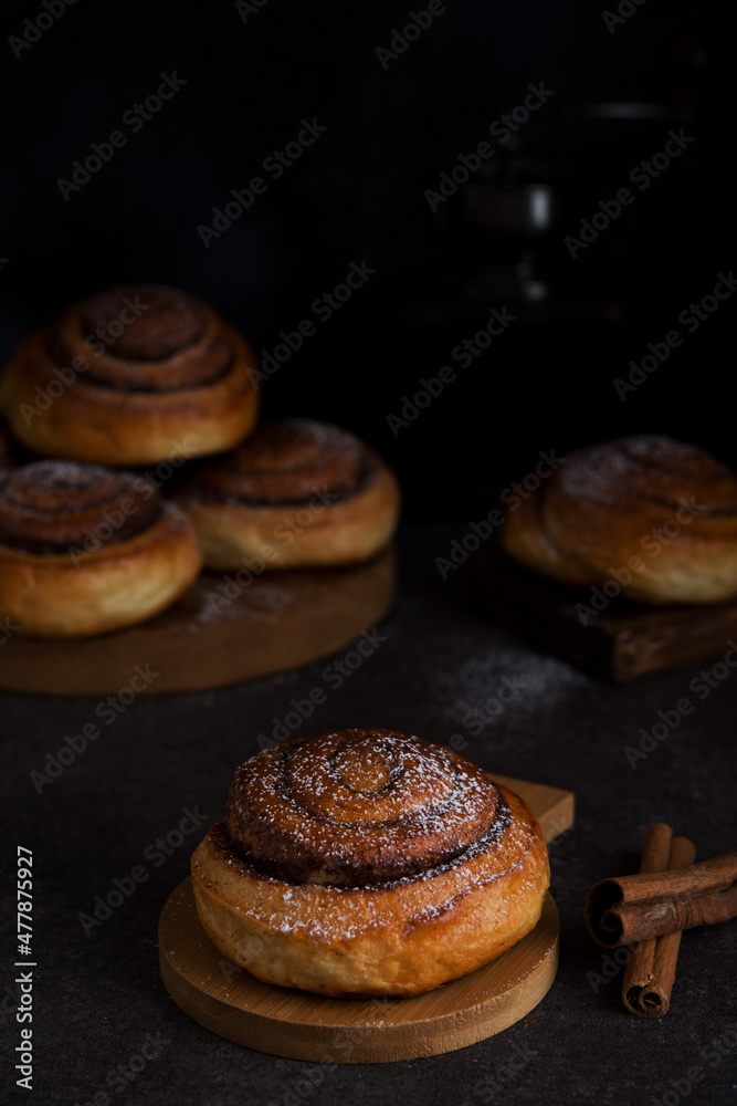 Homemade buns with cinnamon and powdered sugar, homemade pastries Homemade buns with cinnamon and powdered sugar, homemade pastries