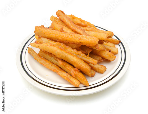 Homemade oil fried sweet potato fries on white background 