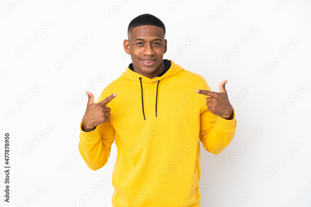 Young latin man isolated on white background giving a thumbs up gesture Young latin man isolated on white background giving a thumbs up gesture