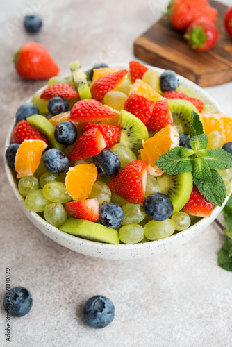 Fruit salad of blueberries  strawberries  grapes and kiwi in a plate