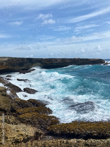 Waves Crashing on Rock Cliff