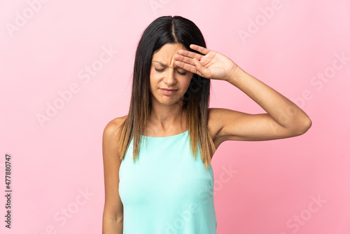 Caucasian girl isolated on pink background with tired and sick expression