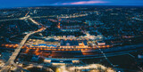 Brest, Belarus. Aerial Bird's-eye View Of Cityscape Skyline. Night Traffic In Residential District. Night Aerial View Of Railway Station. Panorama, Panoramic View