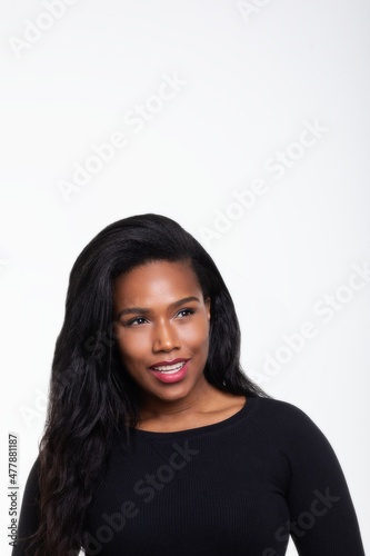 portrait of Afican-American woman on white background smiling looking camera left 0304 photo