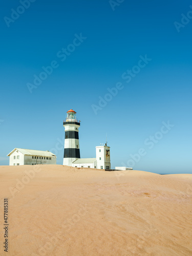 Cape Recife Lighthouse and sand dunes on a clear summer day in Port Elizabeth Gqeberha
