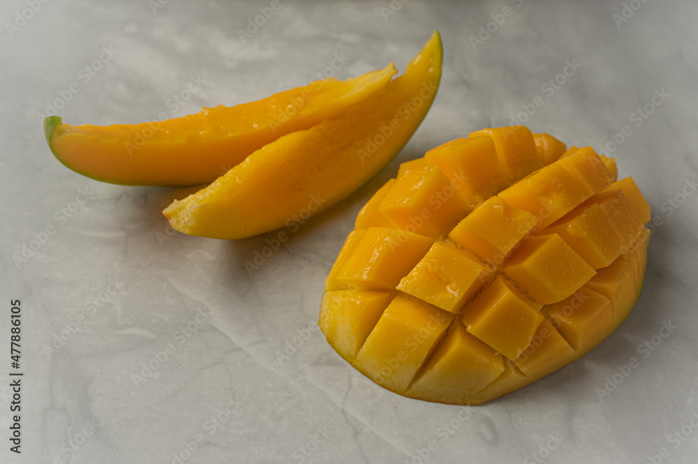 Still life with delicious juicy sliced mango Still life with delicious juicy sliced mango