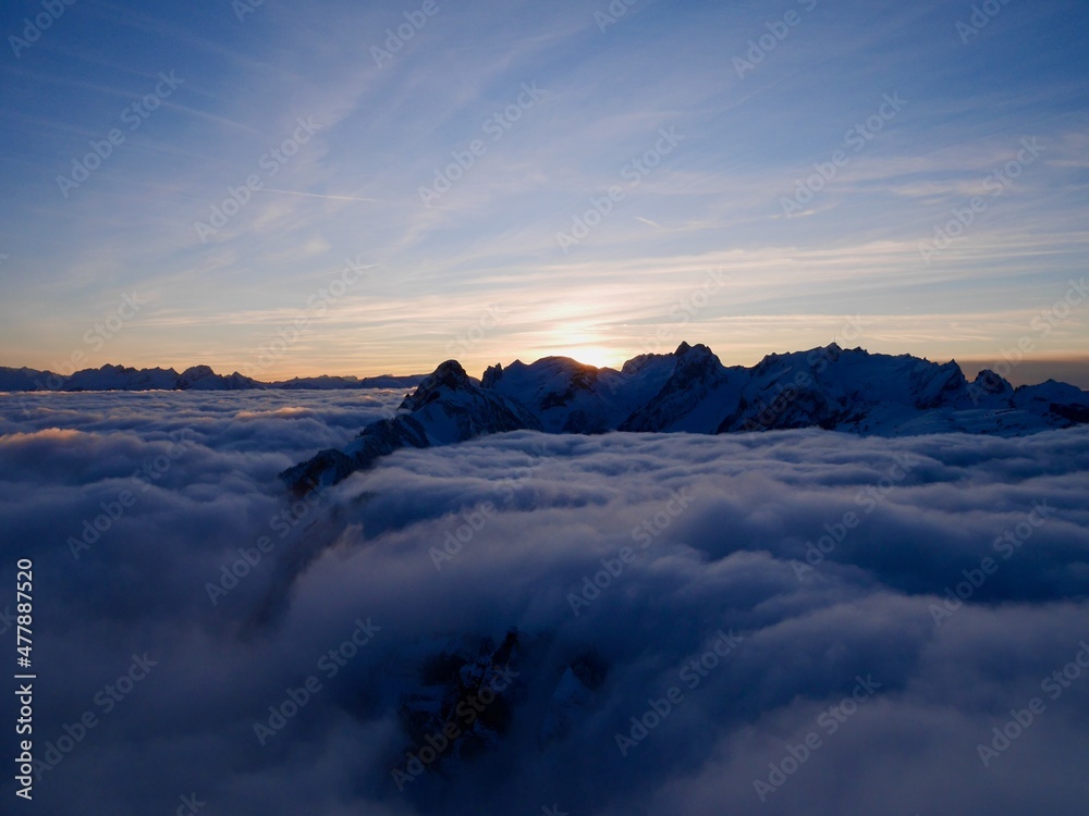 Spectacular view of Alpstein and fog blanket at sunset in winter seen from the mountain station of Hoher Kasten cable car. Appenzell, Switzerland. 