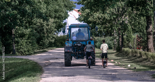 Children chasing tractor