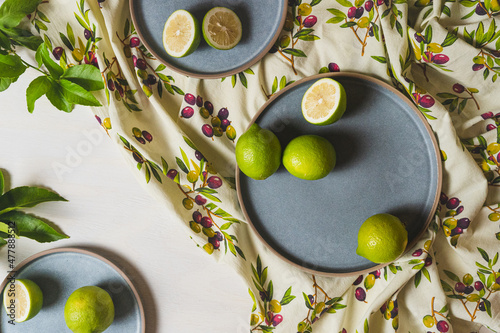 Lemons on blue plates and Italian fabric - Flat lay