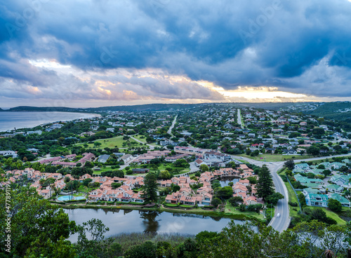 Aerial shot of Plettenberg Bay town from during a cloudy sunset in the Garden Route South Africa © Arnold
