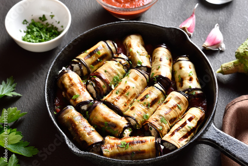 Eggplant (aubergine) rolls with cheese and greens