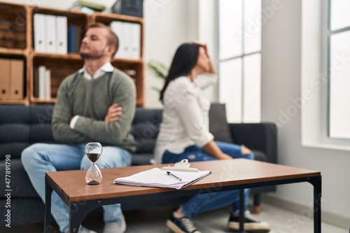 Man and woman having couple therapy session at psychology clinic