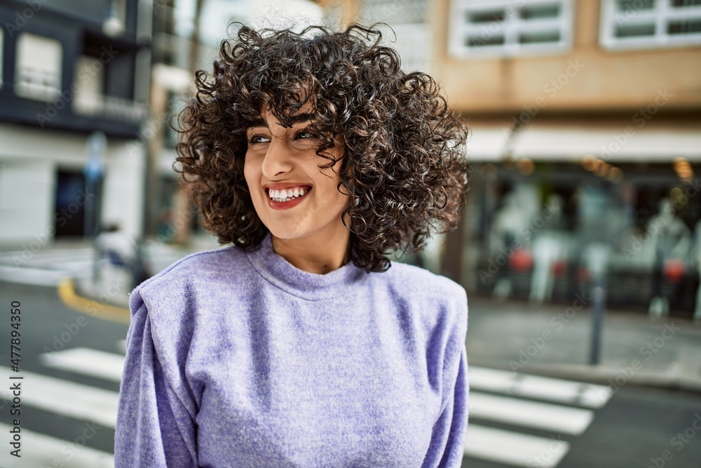 Fototapeta premium Young middle east woman smiling confident at street