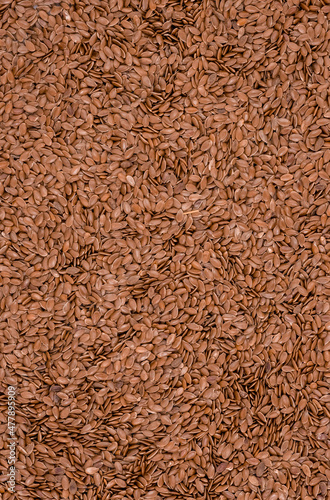 Close up  of brown linseed on background