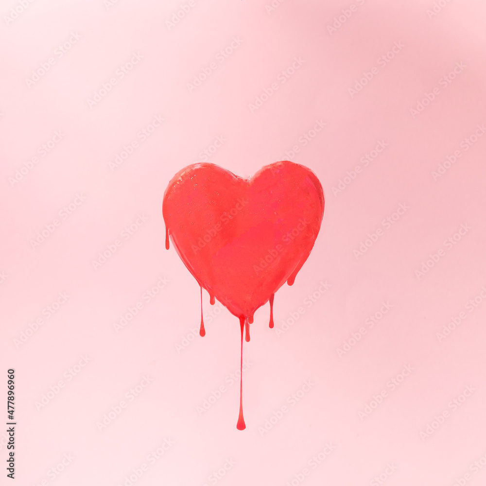 Heart with red slime on a pink background. love concept ideas for Valentine's Day