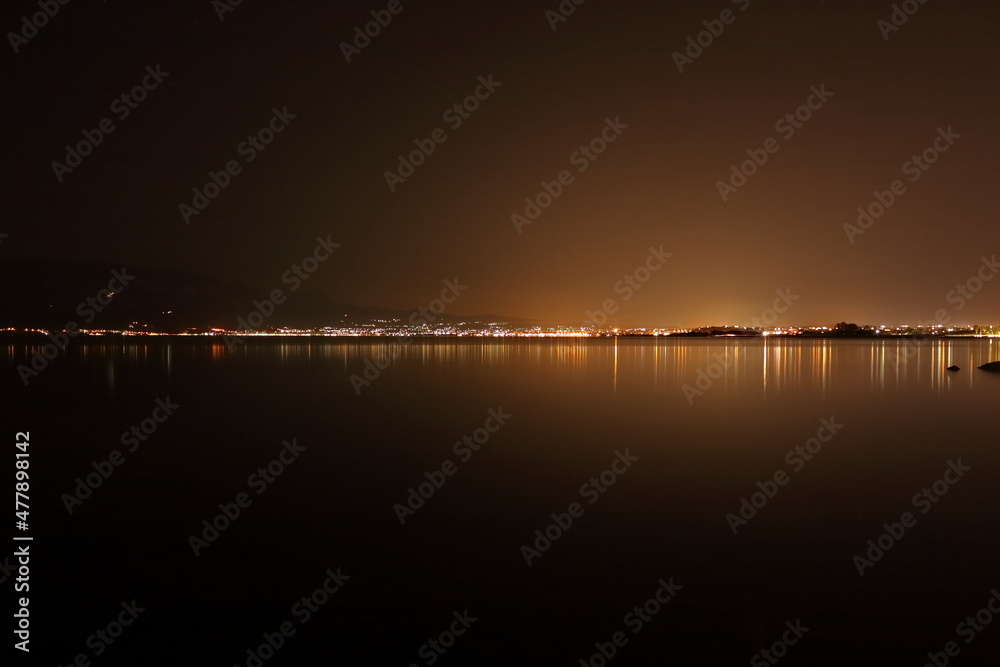 nighttime cityscape over the sea