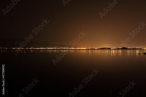 nighttime cityscape over the sea