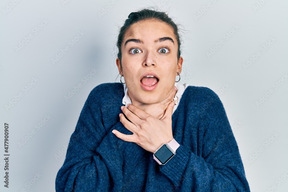 Young caucasian girl wearing casual clothes shouting and suffocate because painful strangle. health problem. asphyxiate and suicide concept.