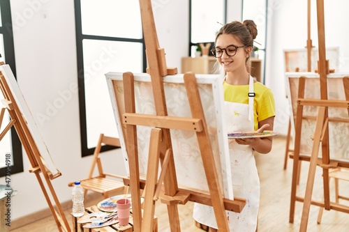 Adorable girl smiling confident drawing at art studio