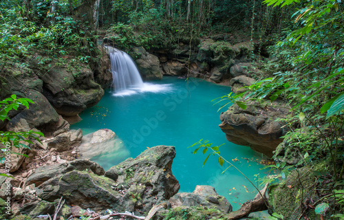 Beautiful waterfall with aqua blue water in the Jamaican jungle