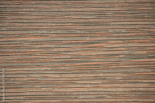Dark walnut  striped natural wood pattern close-up.