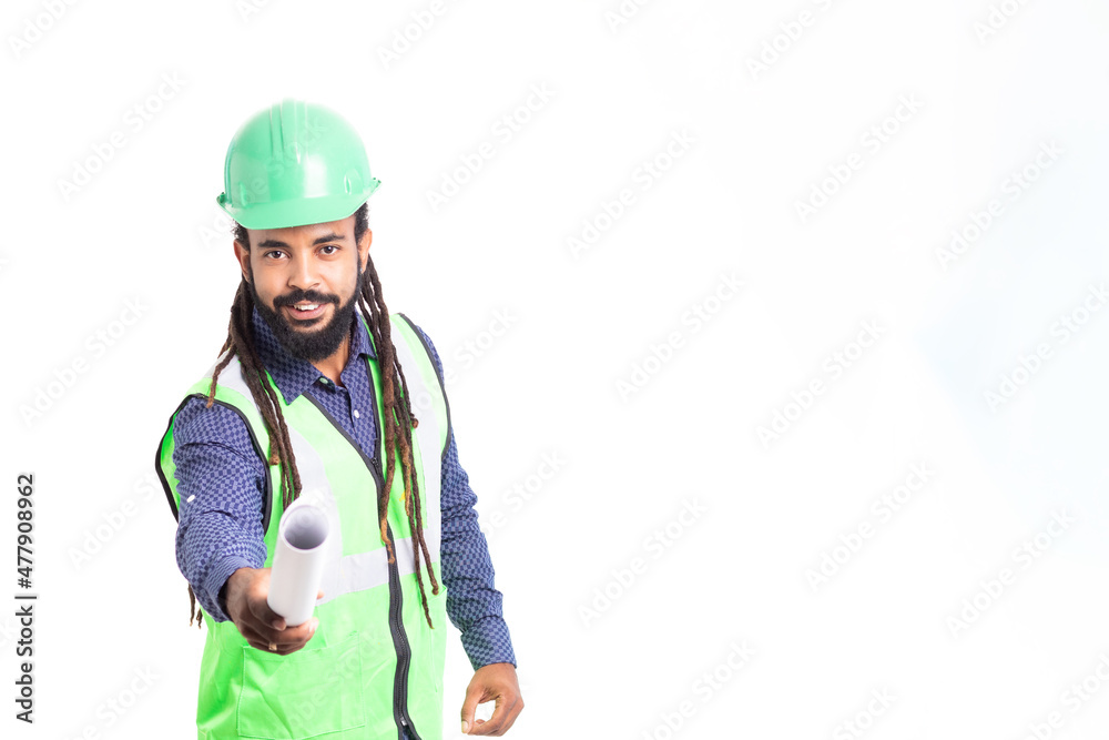 Portrait Men architect Afro Latino with green vest, blue shirt and green helmet. with dreadlocks and beard. looking to the camera and giving a plan isolated