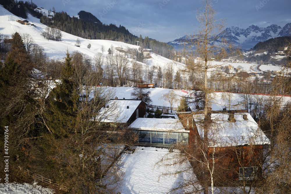 Kirchberg, Austria - December 26, 2021: Ski resort Kitzski in the Alps. Mountain snowy peaks, alpine village