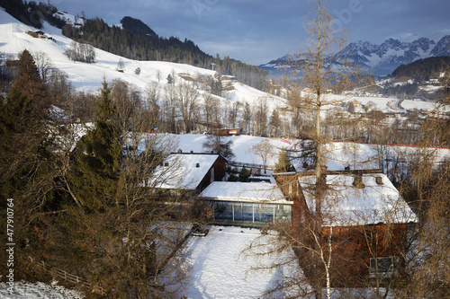 Obraz na płótnie Kirchberg, Austria - December 26, 2021: Ski resort Kitzski in the Alps. Mountain snowy peaks, alpine village w salonie
