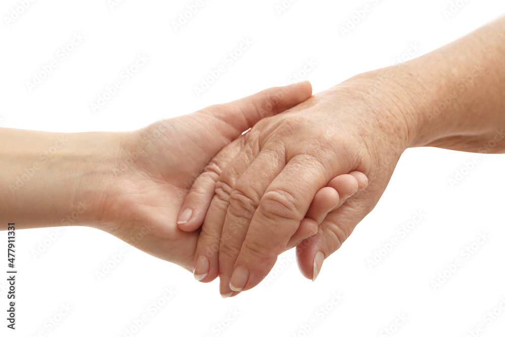 Young and elderly women holding hands together on white background, closeup Young and elderly women holding hands together on white background, closeup