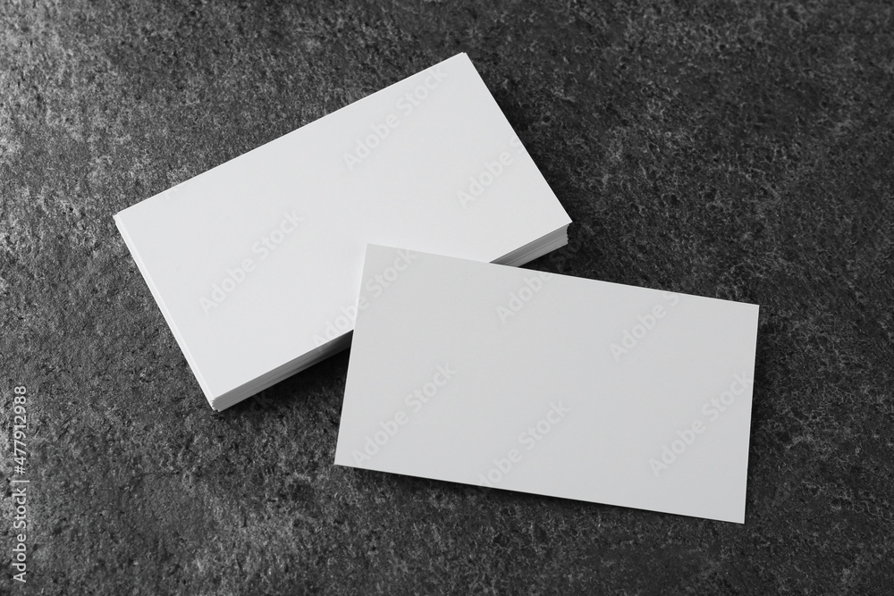 Blank business cards on grey table, above view. Mockup for design Blank business cards on grey table, above view. Mockup for design