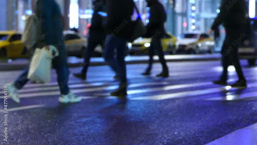 People at crosswalk, unfocused pedestrian crossing at night in Moscow People at crosswalk, unfocused pedestrian crossing at night in Moscow