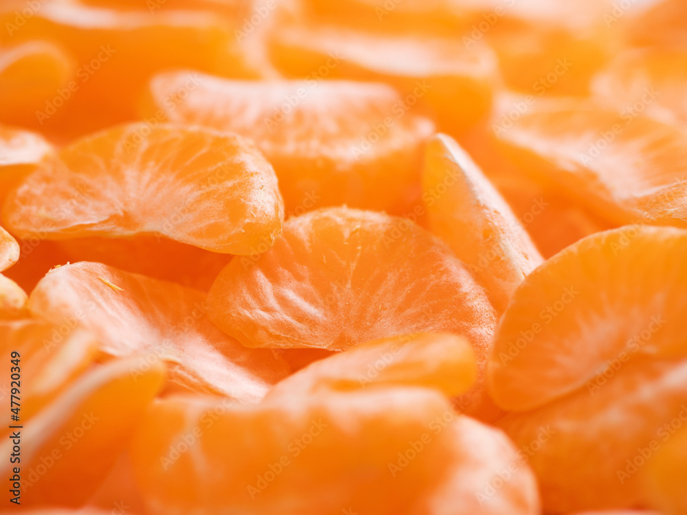 Tangerines. Many beautiful fresh juicy tangerine slices Tangerines. Many beautiful fresh juicy tangerine slices