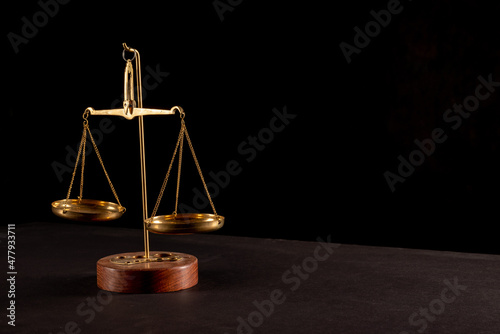 Retro law scales on table. Symbol of justice.