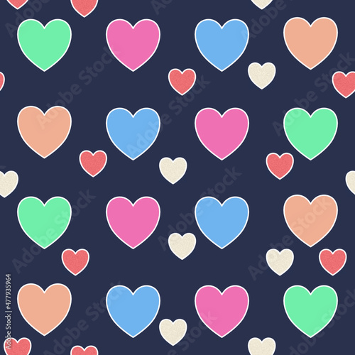 Blue, pink, yellow, green hearts on a dark background. Seamless pattern of abstract elements with texture on a dark blue background for textile.
