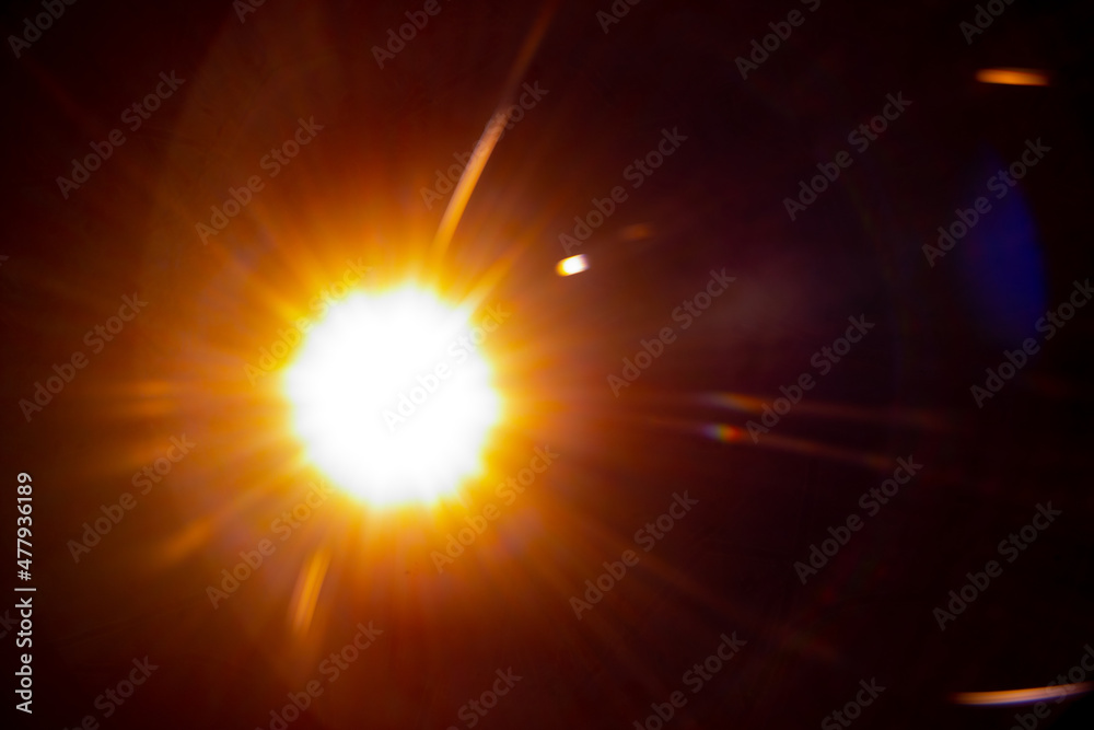 Sun flare on the black background