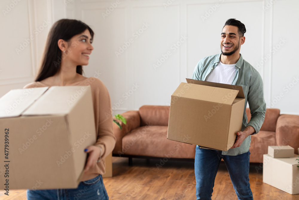 Happy man and woman holding cardboard boxes Happy man and woman holding cardboard boxes