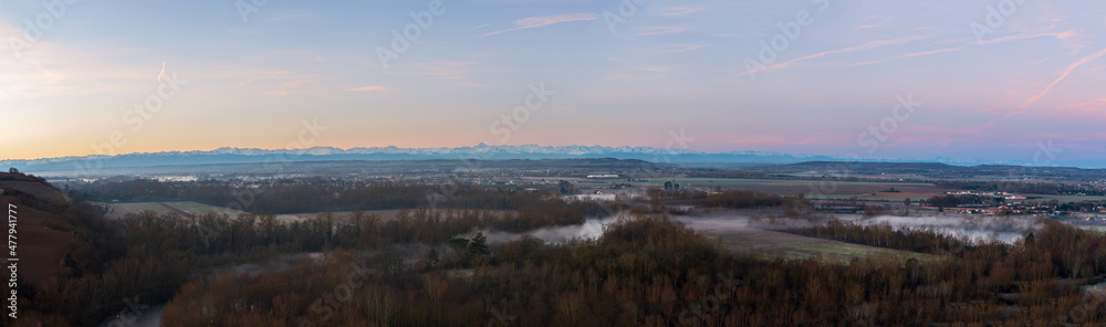 Panorama on the chain of the Pyrenees at sunrise, from Clermont le Fort, in Haute Garonne, Occitanie, France