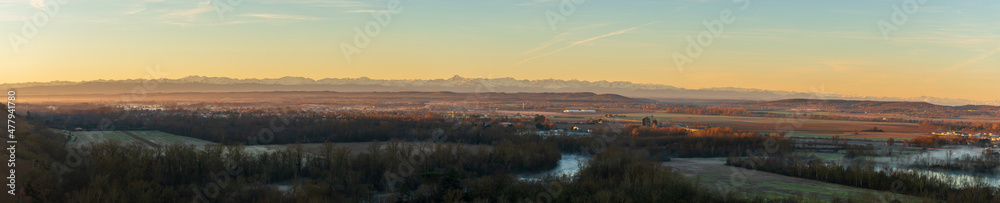 Panorama on the chain of the Pyrenees at sunrise, from Clermont le Fort, in Haute Garonne, Occitanie, France