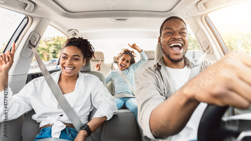 Happy Black Family Of Three Singing Having Fun Riding Car