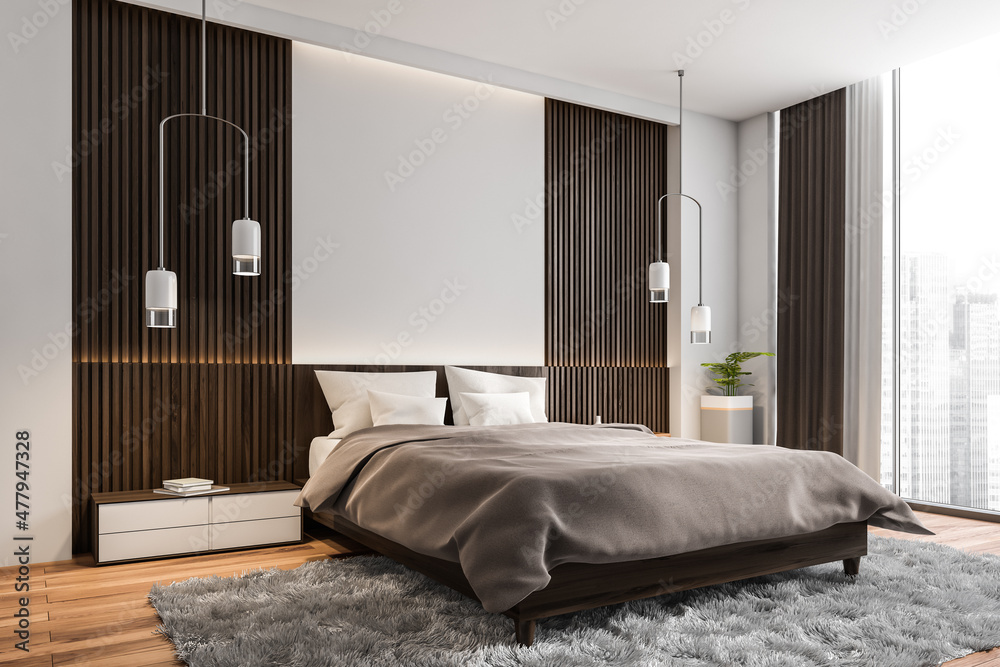 Corner view of modern white and grey bedroom with wood wall panels