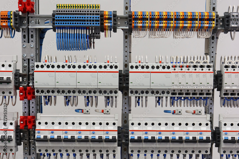Colored electrical terminals, 4-pole and 2-pole electromagnetic contactors, differential current switches are located in the electrical panel.