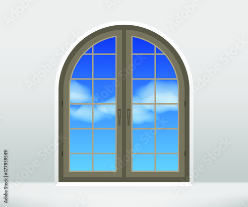 Closed window in the wall. Arched window with view of blue sky. Architecture detail