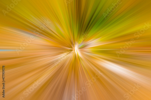 Saturated orange, green and yellow acceleration with flash in the center