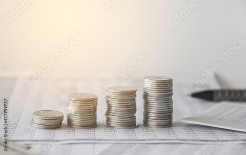 Stack of money coin on accounting sheet with selective focus, Business and financial concept. 