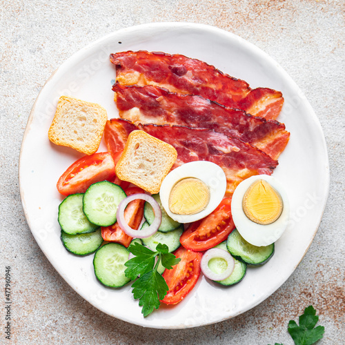 breakfast bacon, eggs, vegetables healthy meal food snack on the table copy space food background