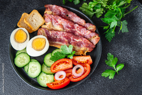 breakfast bacon, eggs, vegetables healthy meal food snack on the table copy space food background