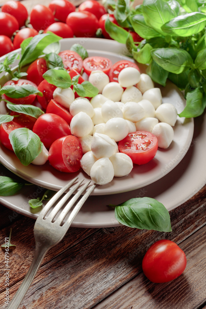 Mini mozzarella with tomatoes and green basil. Mini mozzarella with tomatoes and green basil.