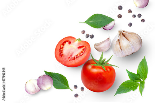 Tomato with basil leaves, garlic, onion and black pepper isolated on white background. Top view. Flat lay. Copy space.